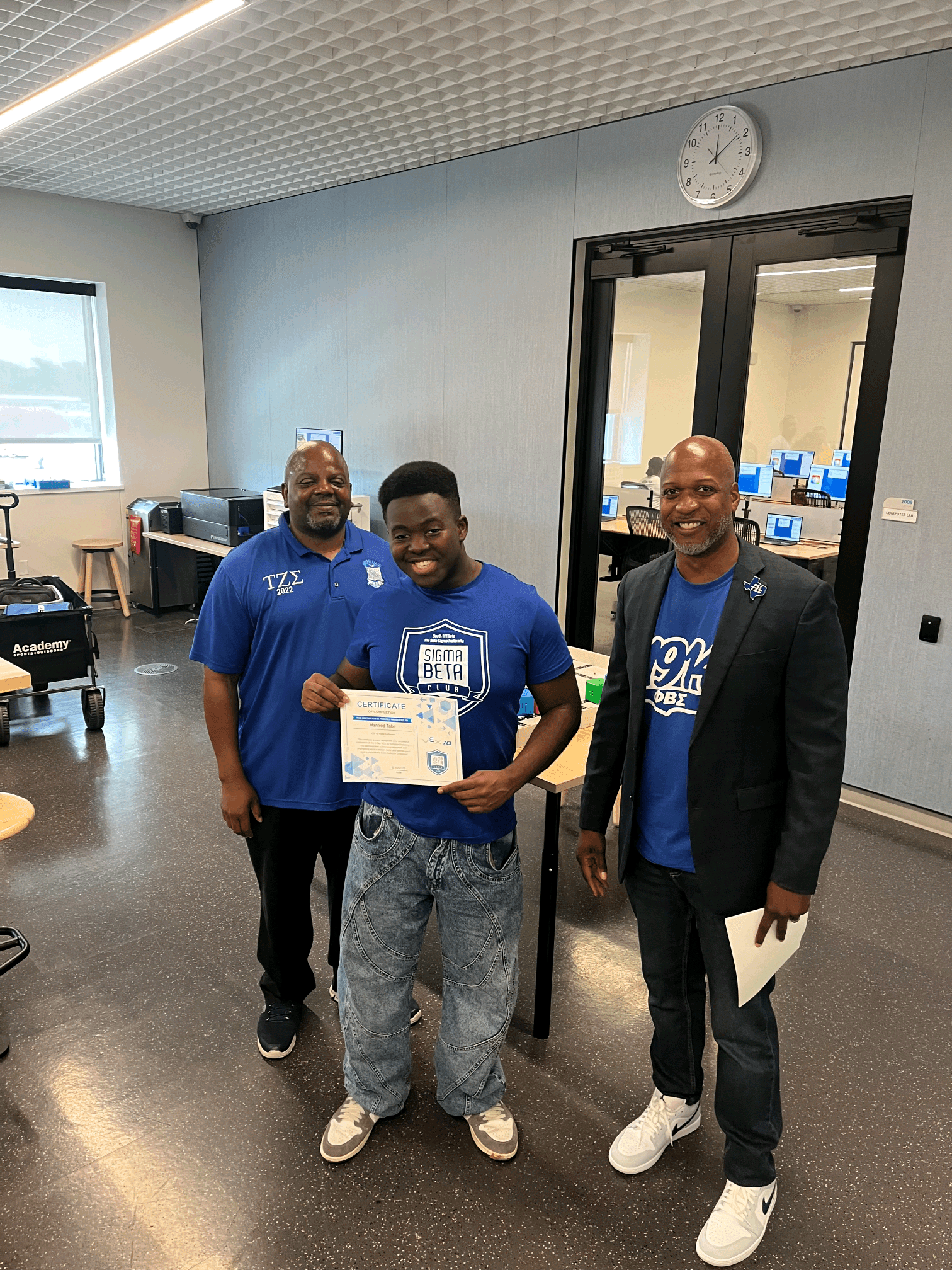 A Sigma Beta Club member with his STEM day certificate