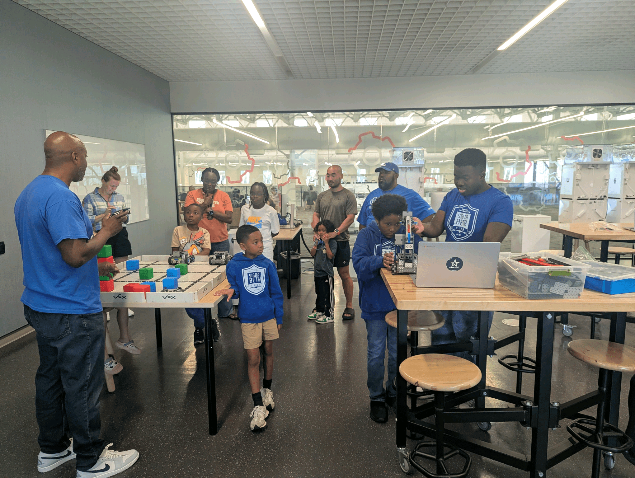 Sigma Beta Club members at a STEM day robotics workshop